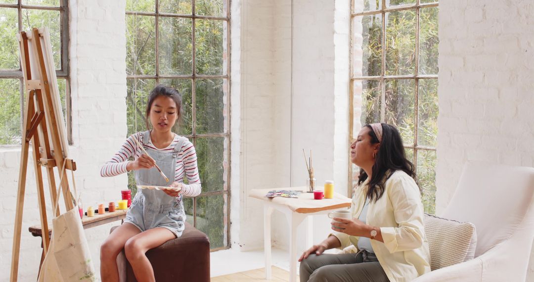 Diverse Female Artists Crafting in Bright Art Studio