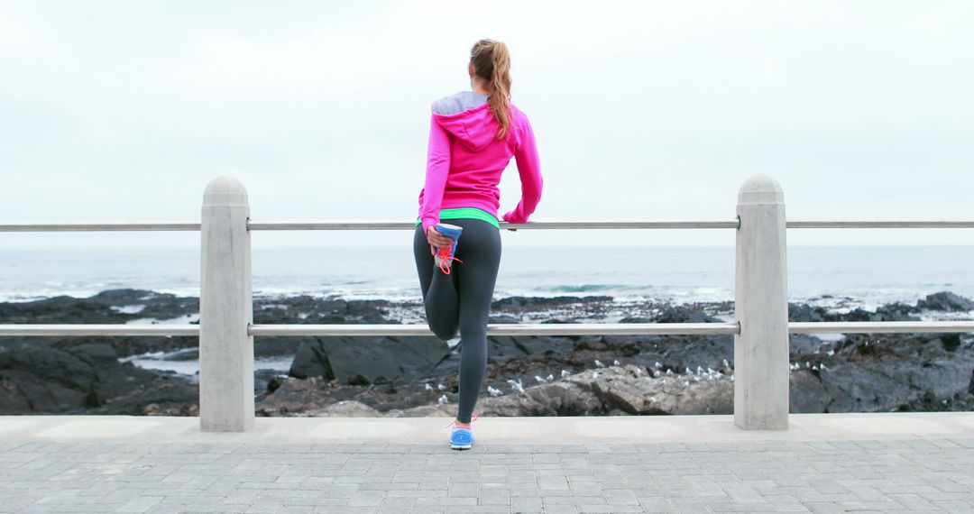 Woman Stretching on Seaside Promenade Before Run - Free Images, Stock Photos and Pictures on Pikwizard.com