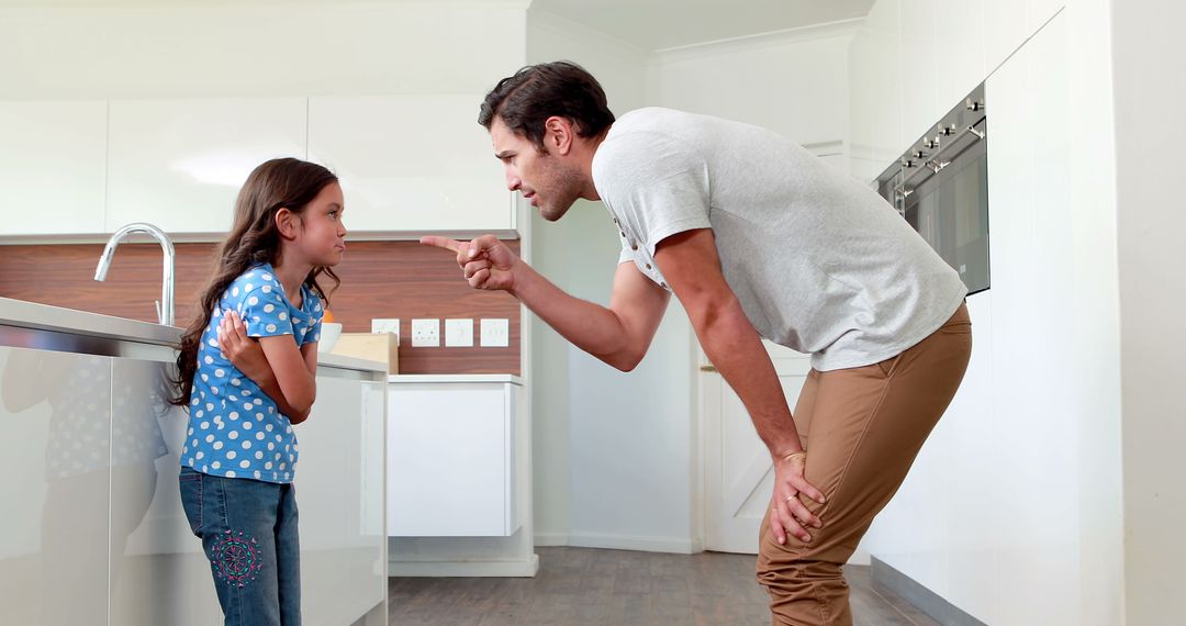 Father Disciplining Young Daughter in Kitchen - Free Images, Stock Photos and Pictures on Pikwizard.com