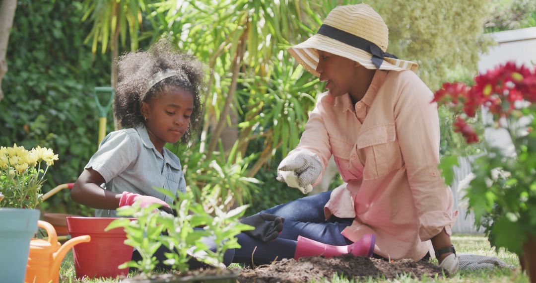 African American Grandmother and Granddaughter Gardening and Bonding Together Outdoors - Free Images, Stock Photos and Pictures on Pikwizard.com