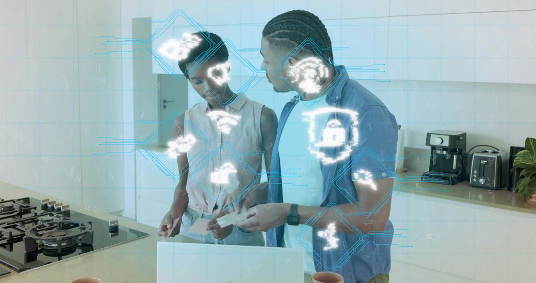 Black couple reviewing smart home bills using laptop with digital security icons overlay