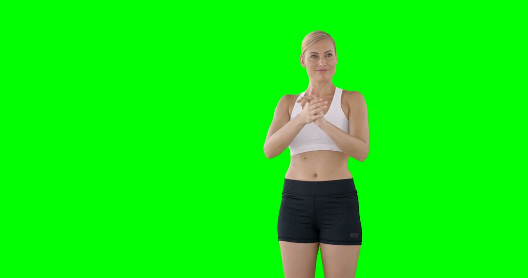 Fit Woman Preparing for Workout on Green Screen Background - Free Images, Stock Photos and Pictures on Pikwizard.com