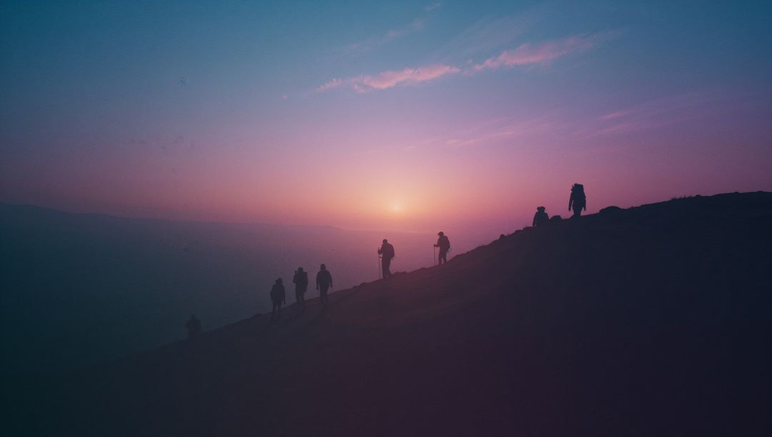 Hikers Climbing Ridge During Majestic Dawn Adventure