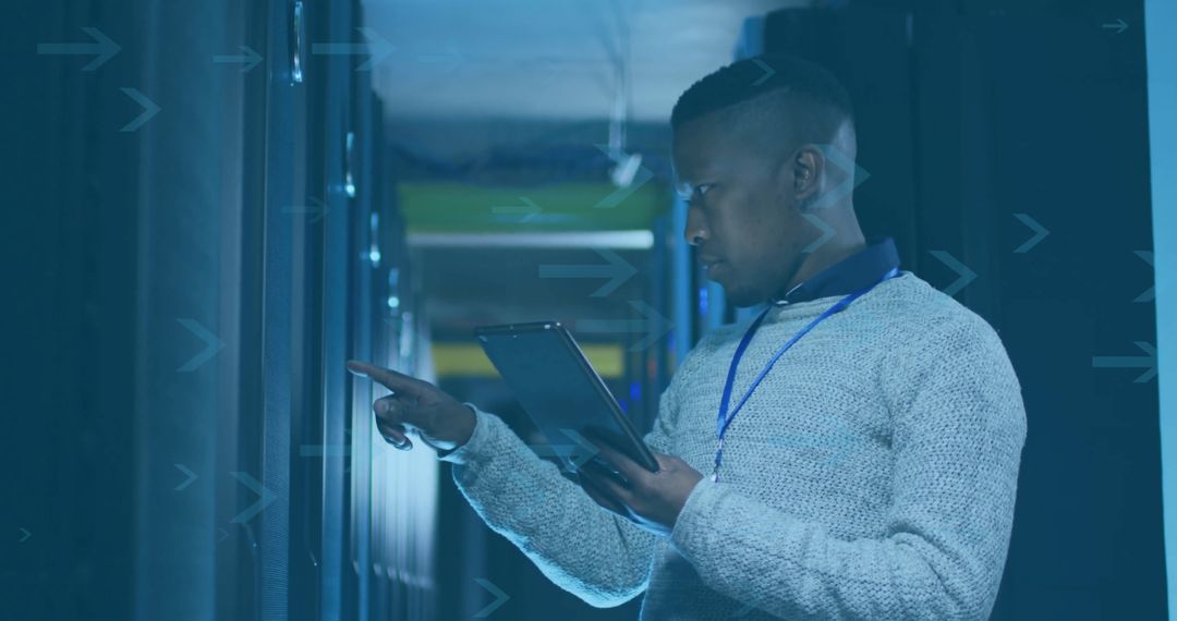 IT Specialist Using Tablet in Modern Data Center