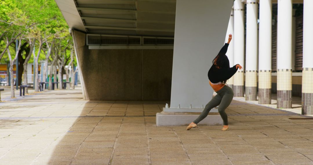 Contemporary Dancer Performing Outdoors Under Bridge Structure - Free Images, Stock Photos and Pictures on Pikwizard.com