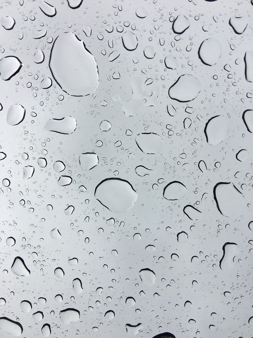 Rain Droplets on Glass with Clear Sky Background - Free Images, Stock Photos and Pictures on Pikwizard.com