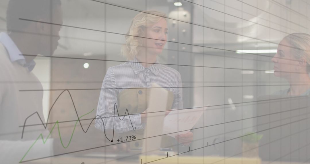 Diverse Colleagues Discussing Work Overlaid with Business Graphs