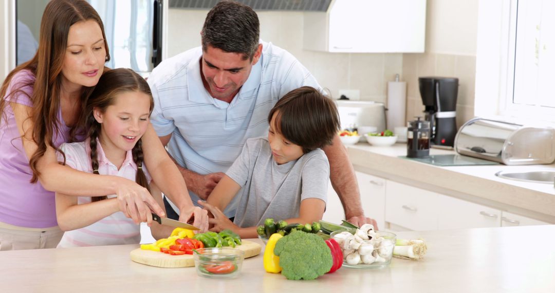 Mother teaching children to slice vegetables in bright modern kitchen - Free Images, Stock Photos and Pictures on Pikwizard.com