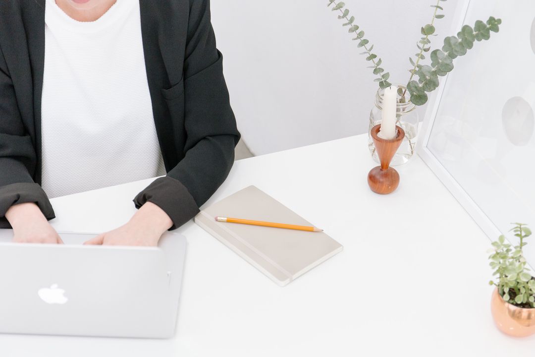 Minimalist Work Desk with Person Typing on Laptop - Free Images, Stock Photos and Pictures on Pikwizard.com