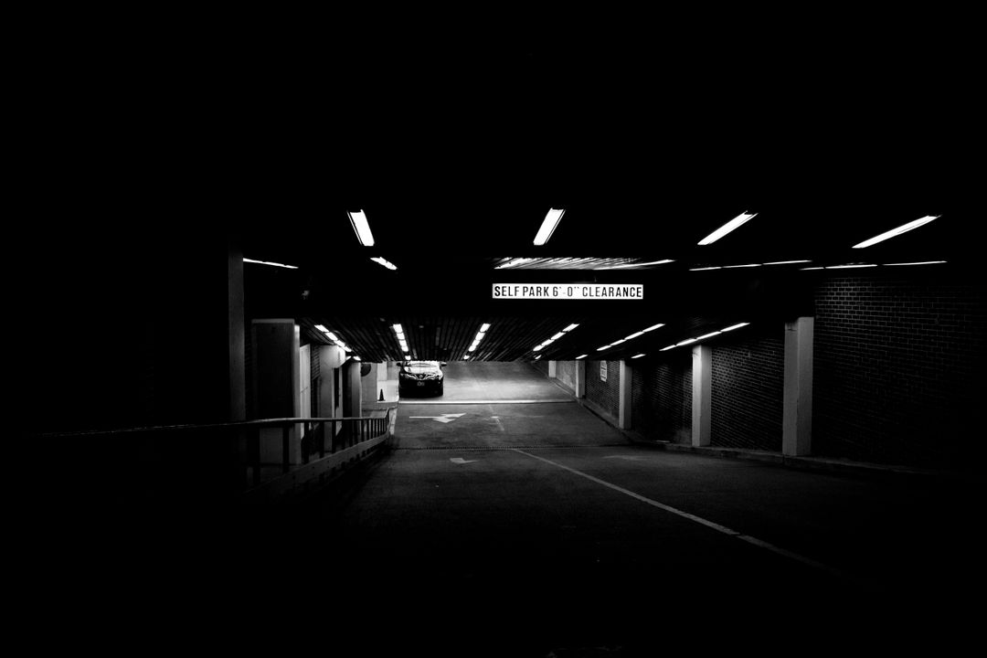 Empty Underground Parking Garage at Night with Low Lighting - Free Images, Stock Photos and Pictures on Pikwizard.com