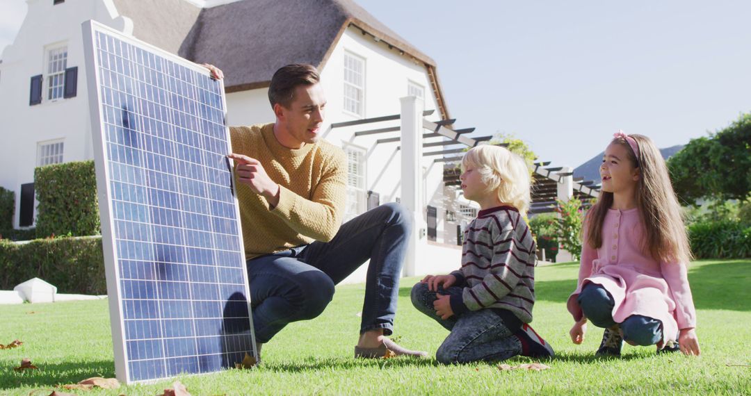 Father Teaching Children About Solar Panels on Sunny Day - Free Images, Stock Photos and Pictures on Pikwizard.com