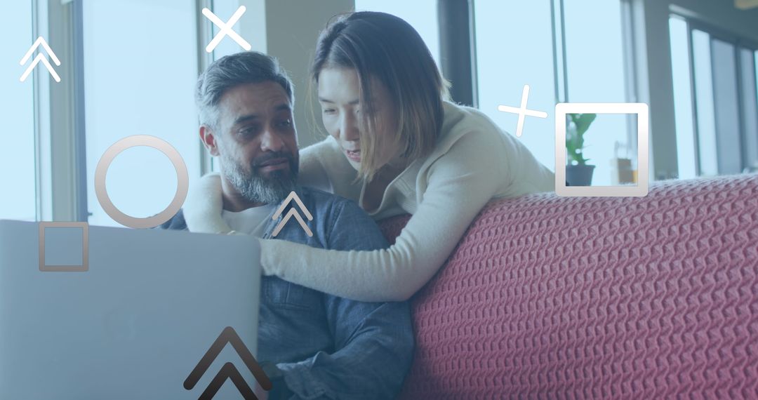 Couple Planning Vacation Using Laptop With Digital Overlay