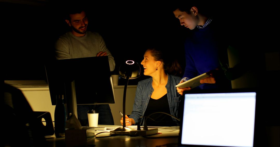 Group of Young Professionals Collaborating in Office Late at Night - Free Images, Stock Photos and Pictures on Pikwizard.com