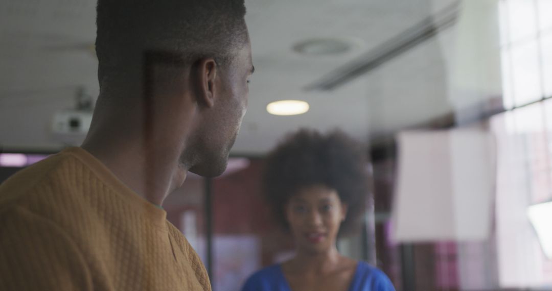 African American Colleagues Discussing Ideas in Office