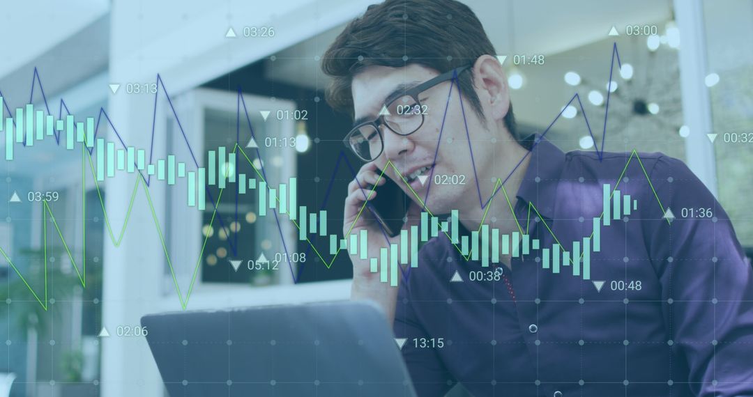 Asian Professional Analyzing Financial Charts on Computer