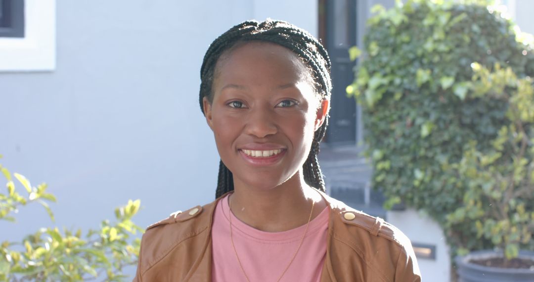 Smiling Black Woman Outdoors on Sunny Day - Free Images, Stock Photos and Pictures on Pikwizard.com