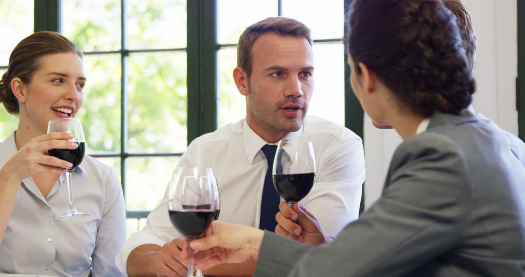 Business Professionals Networking in Relaxed Setting Over Wine