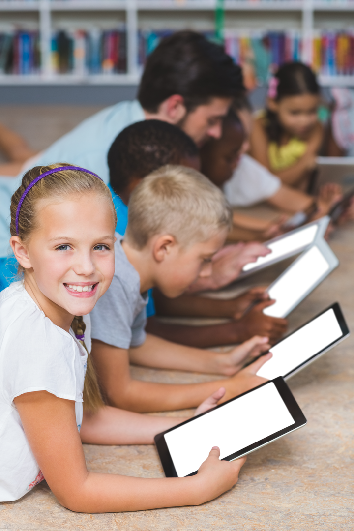 Transparent happy schoolgirl with classmates using digital tablets in classroom - Download Free Stock Images Pikwizard.com