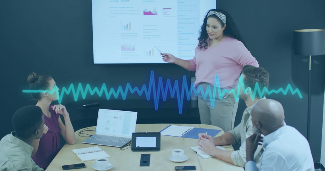 Team Analyzing Business Reports and Data Insights in Modern Office