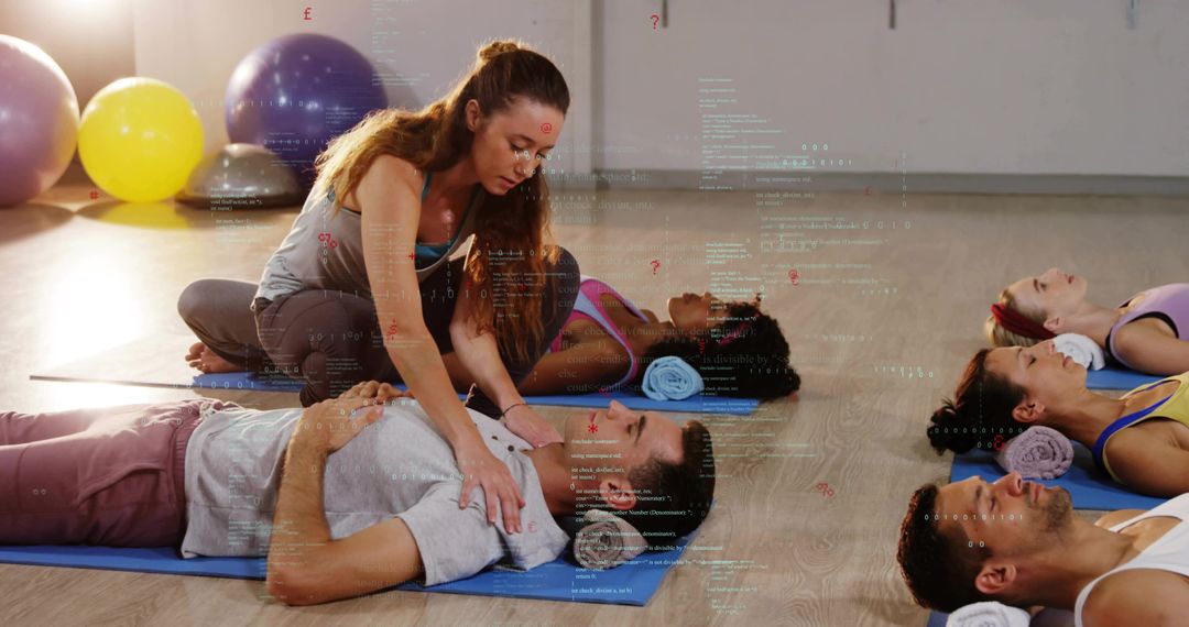 Fitness instructor guiding breathing and relaxation in yoga class with digital wellness overlay
