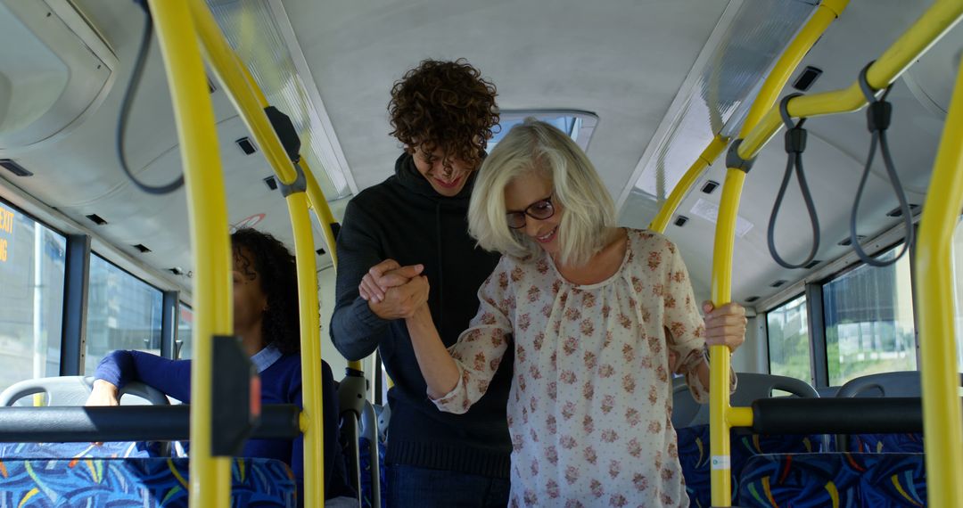 Young man helping elderly woman inside bus - Free Images, Stock Photos and Pictures on Pikwizard.com