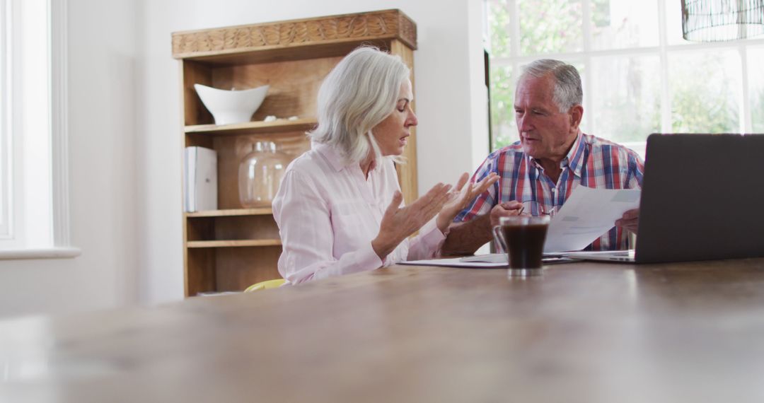 Elderly Couple Managing Finances at Home