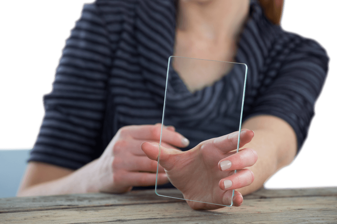 Businesswoman Demonstrating Transparent Glass Interface at Table