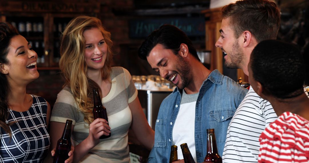 Cheerful Friends Socializing in Pub with Beer