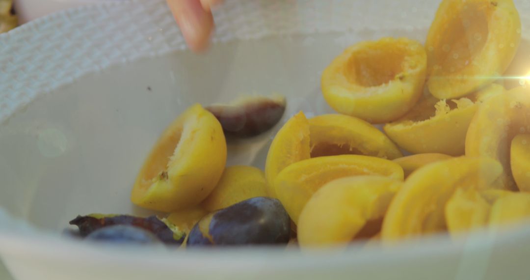 Fresh Sliced Plums in Sunlit Bowl