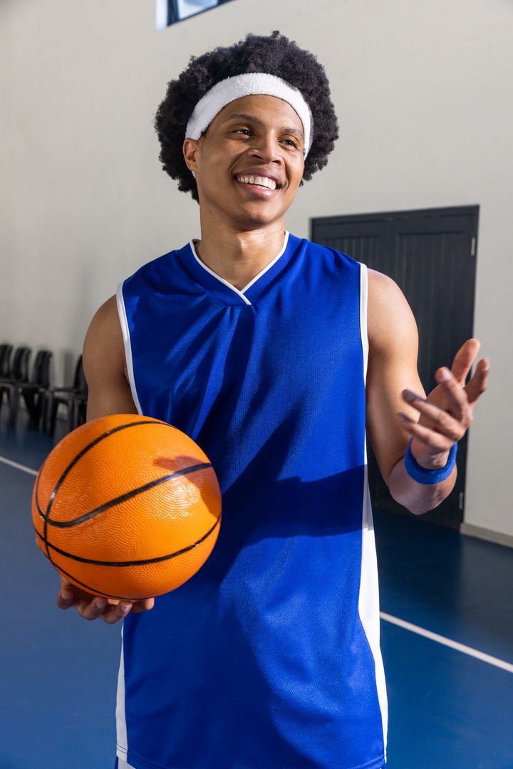 Basketball Player Relaxing and Smiling After Game