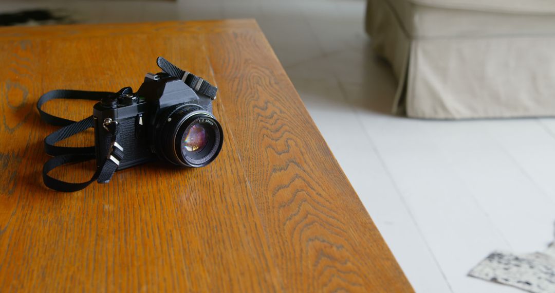 Close-up of Vintage SLR Camera on Wooden Table - Free Images, Stock Photos and Pictures on Pikwizard.com