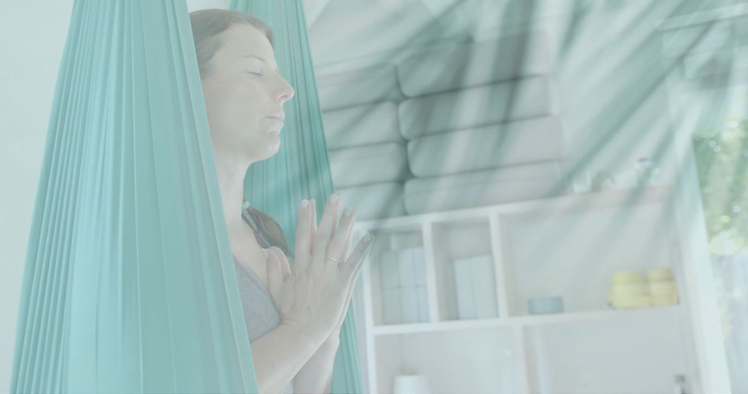Peaceful Meditation in Aerial Yoga Class with Sunlight