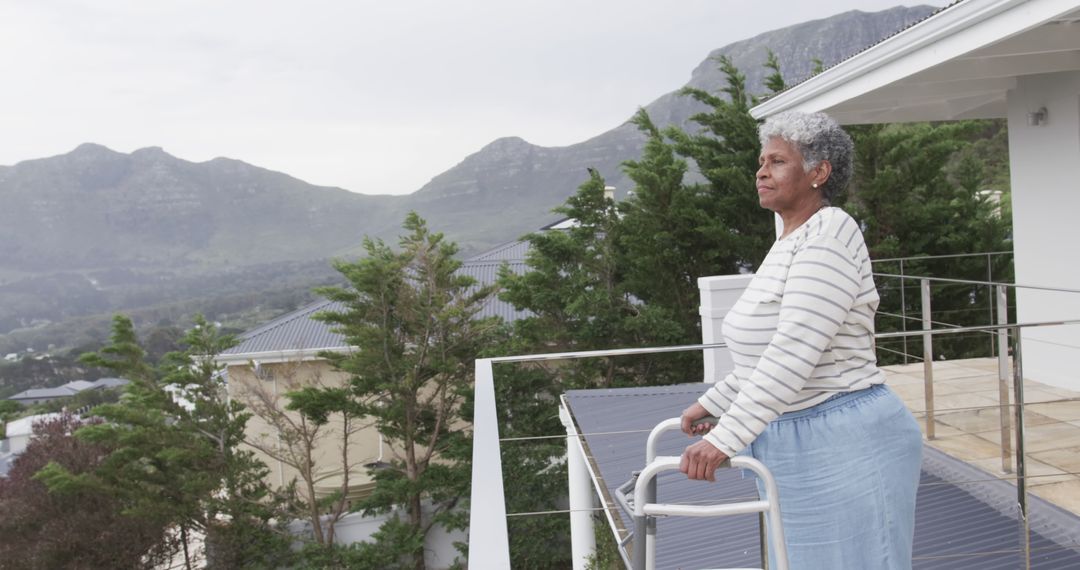 Senior Woman with Walker Enjoying Mountain View from Terrace - Free Images, Stock Photos and Pictures on Pikwizard.com