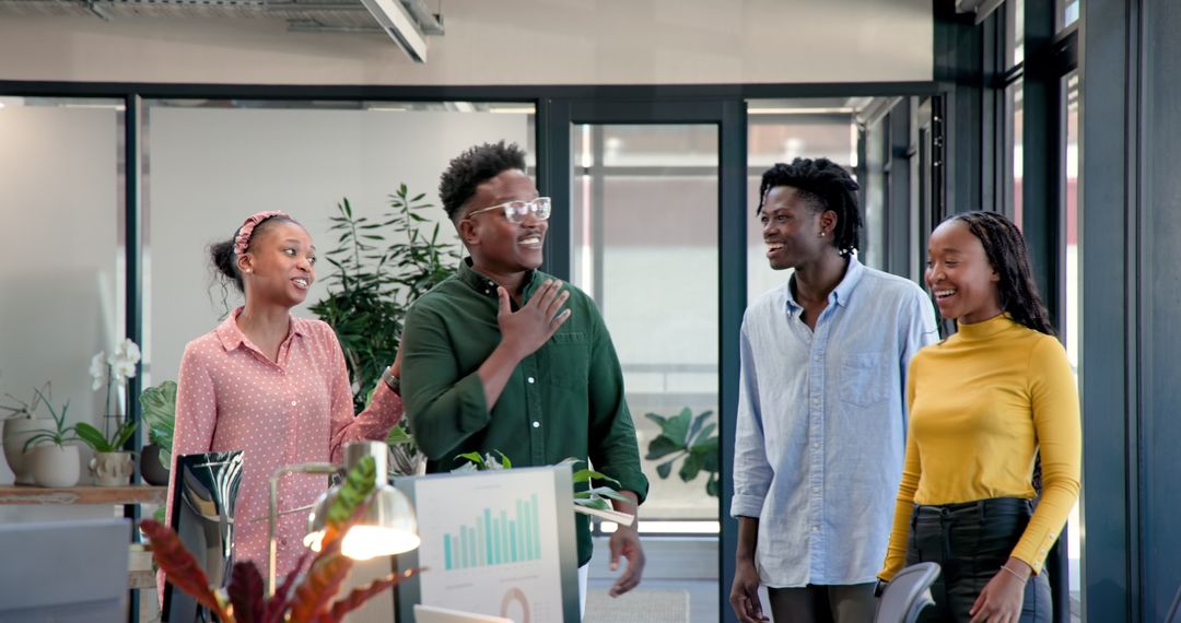 Happy Colleagues Collaborating in Modern Office Workspace