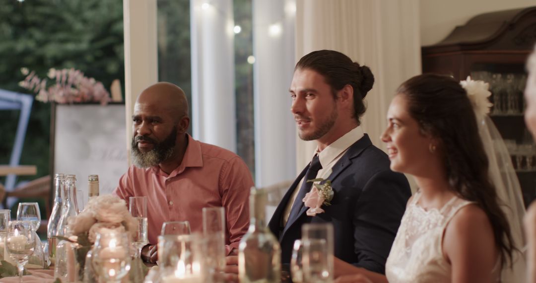 Wedding Guests Engaging in Festive Dinner Conversation