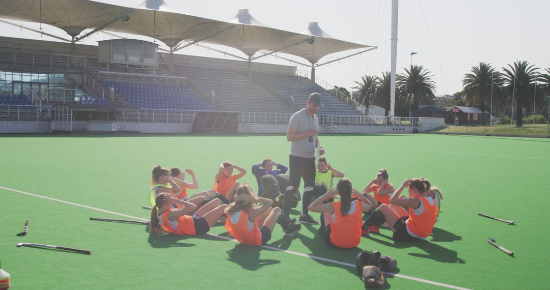 Field Hockey Coach Giving Team Instructions During Training - Free Images, Stock Photos and Pictures on Pikwizard.com