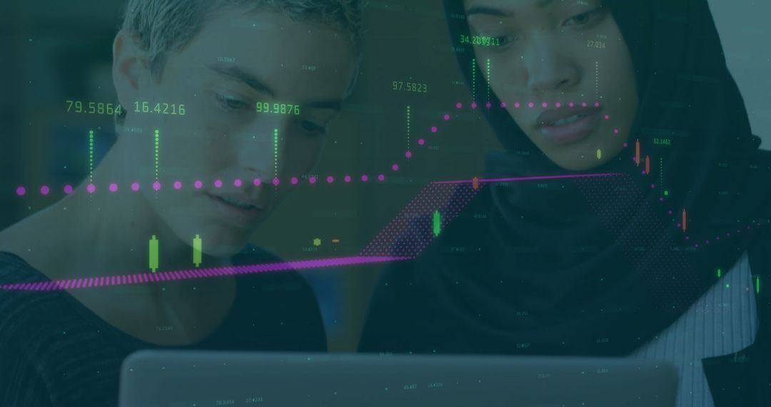 Diverse Professionals Analyzing Financial Trading Data on Laptop