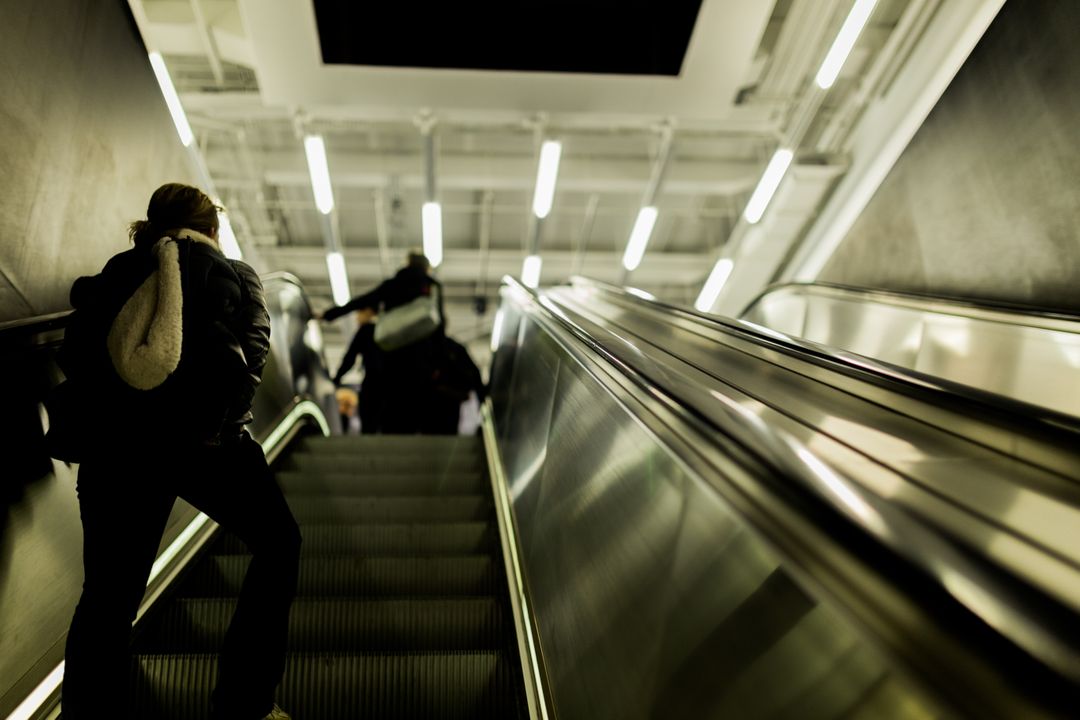 People Riding Escalator in Modern Subway Station - Free Images, Stock Photos and Pictures on Pikwizard.com