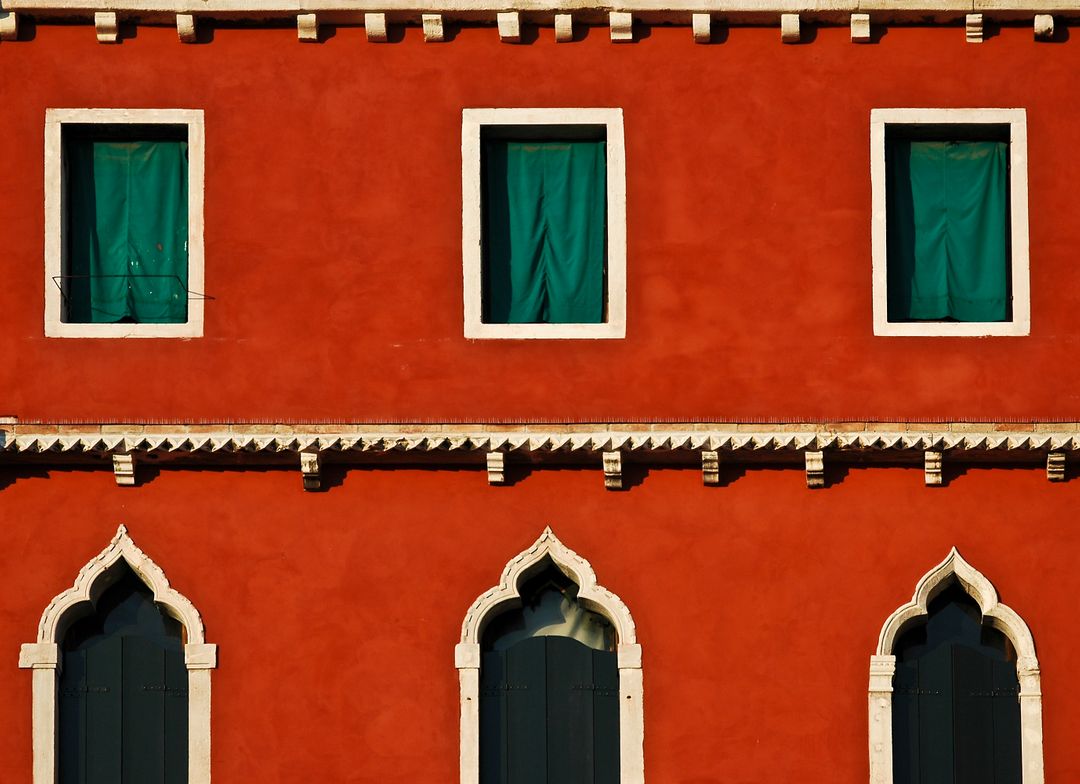 Colorful Red Venetian Building Facade with Green Windows - Free Images, Stock Photos and Pictures on Pikwizard.com