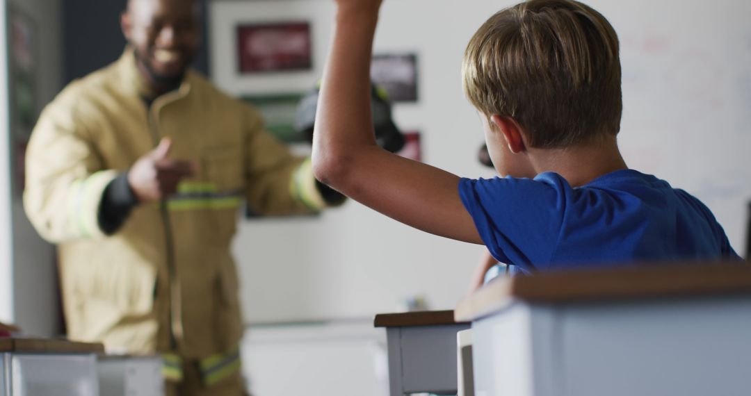 Firefighter Engaging with Excited Children in Classroom Session - Free Images, Stock Photos and Pictures on Pikwizard.com