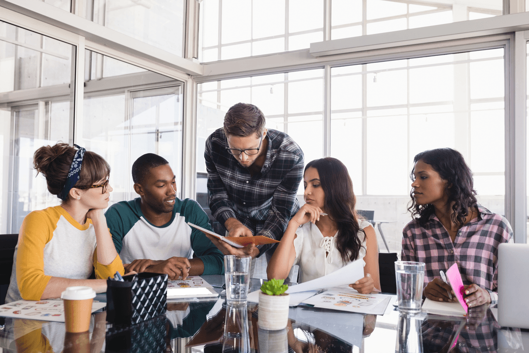 Transparent Office Space with Diverse Team Collaborating