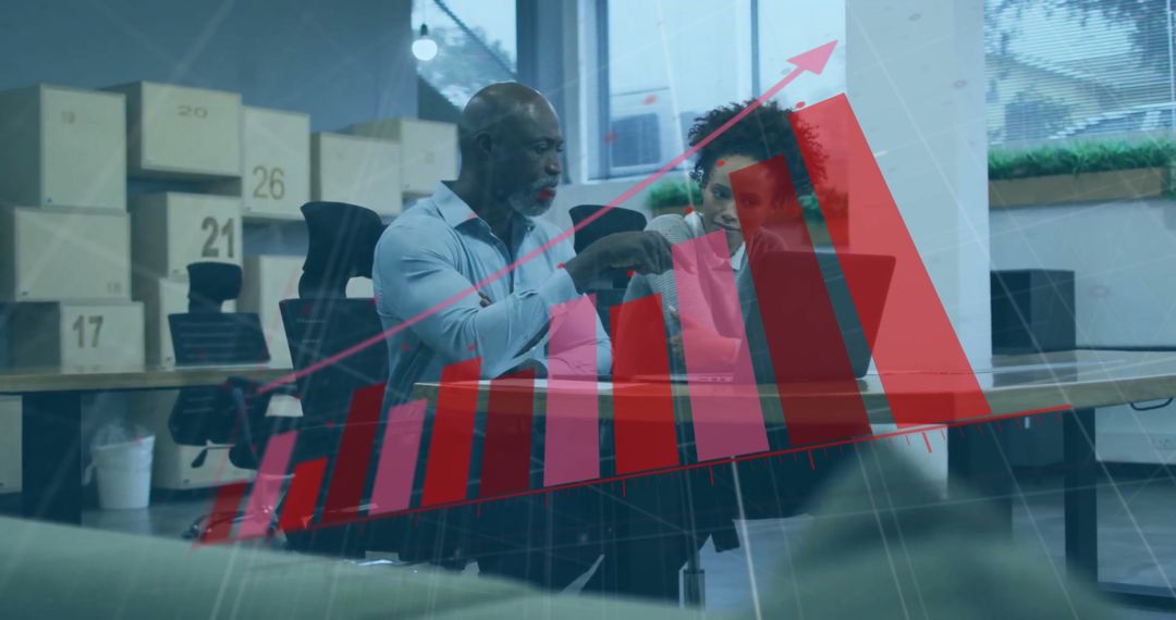 Diverse Business Team Reviewing Growth Graph in Modern Office