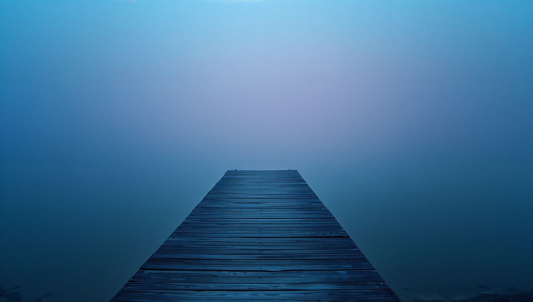 Foggy Wooden Dock by Tranquil Lakeside Evoking Serenity