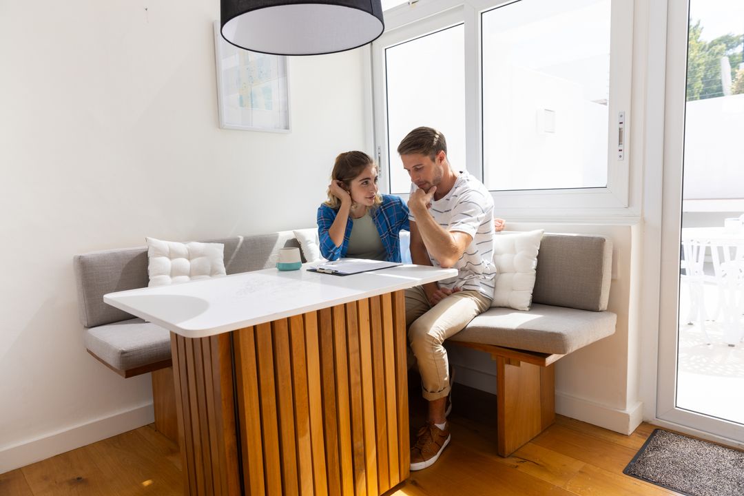 Couple Collaborating in Bright Minimalist Dining Nook