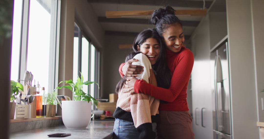 Image of happy biracial female friends embracing - Free Images, Stock Photos and Pictures on Pikwizard.com