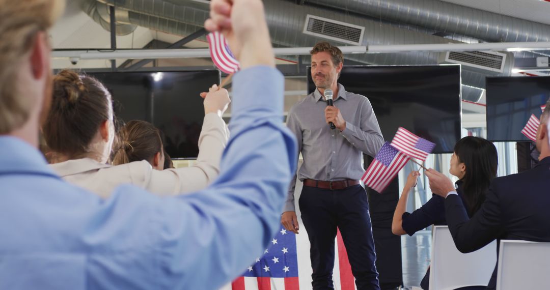 Businessman Giving Motivational Speech in Office with Waving American Flags - Free Images, Stock Photos and Pictures on Pikwizard.com