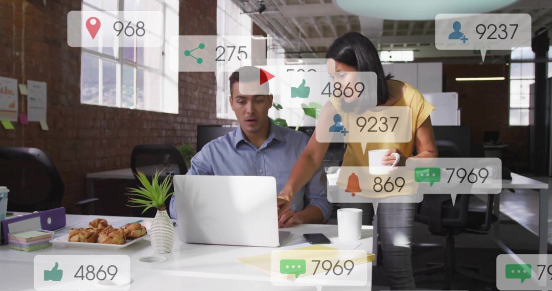 Two Colleagues Discussing Social Metrics in Open Office