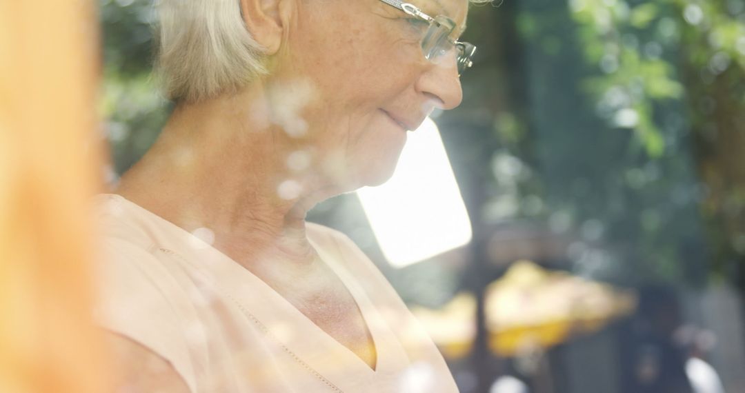 Senior Woman Reflecting Near Sunlit Window - Free Images, Stock Photos and Pictures on Pikwizard.com