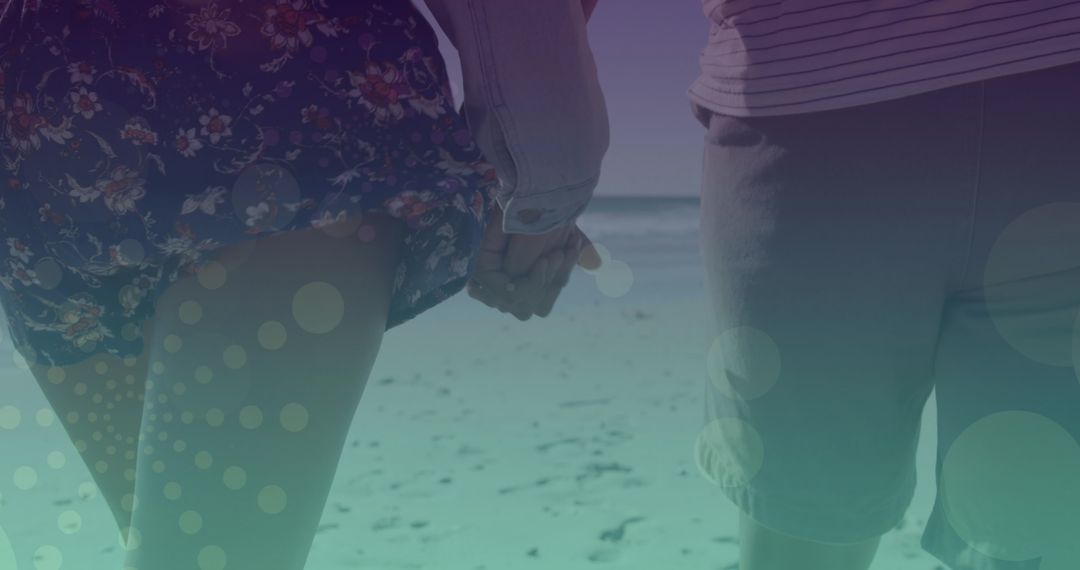 Romantic Caucasian Couple Holding Hands on Beach Walk