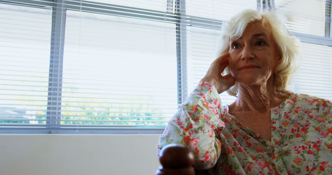 Senior Woman Relaxing Thoughtfully Indicates Warm, Tranquil Setting